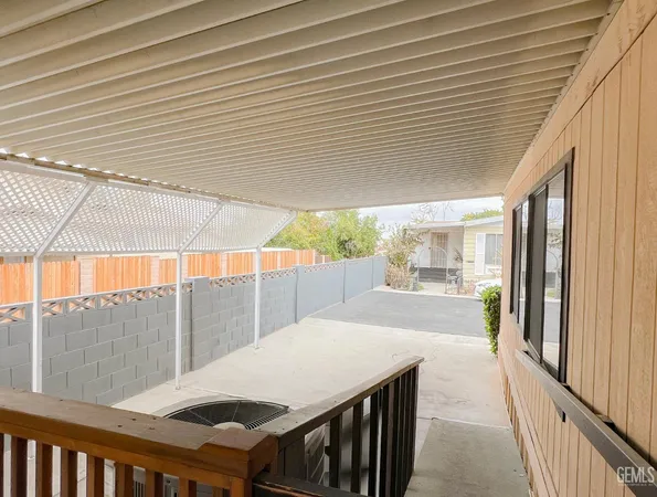 a view of a patio with wooden floor