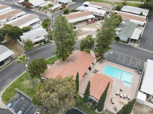 an aerial view of a house with outdoor space