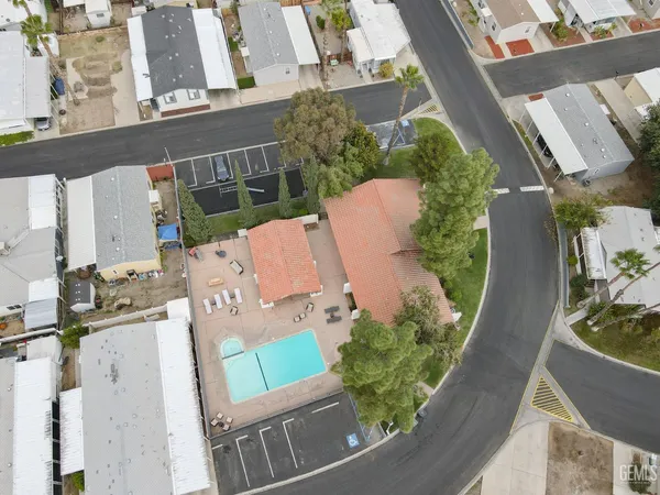 an aerial view of house with yard