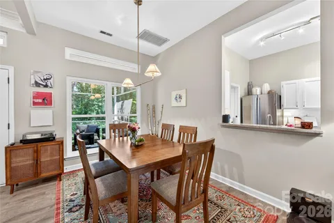 a view of a dining room with furniture window and outside view