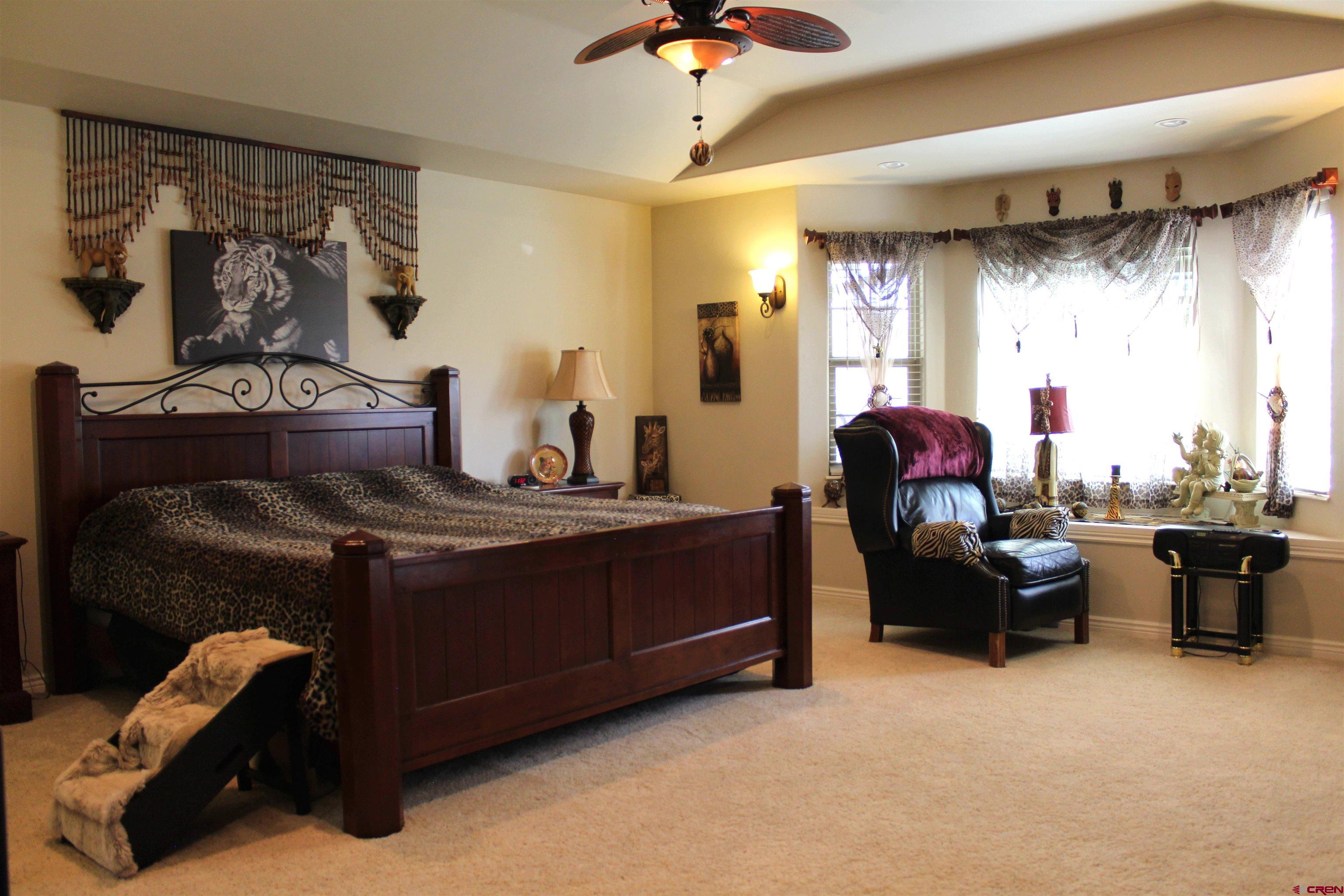635 Northeast 2nd Street Cedaredge, CO 81413 - Photo 14 of 33 a living room with furniture a window and a chandelier