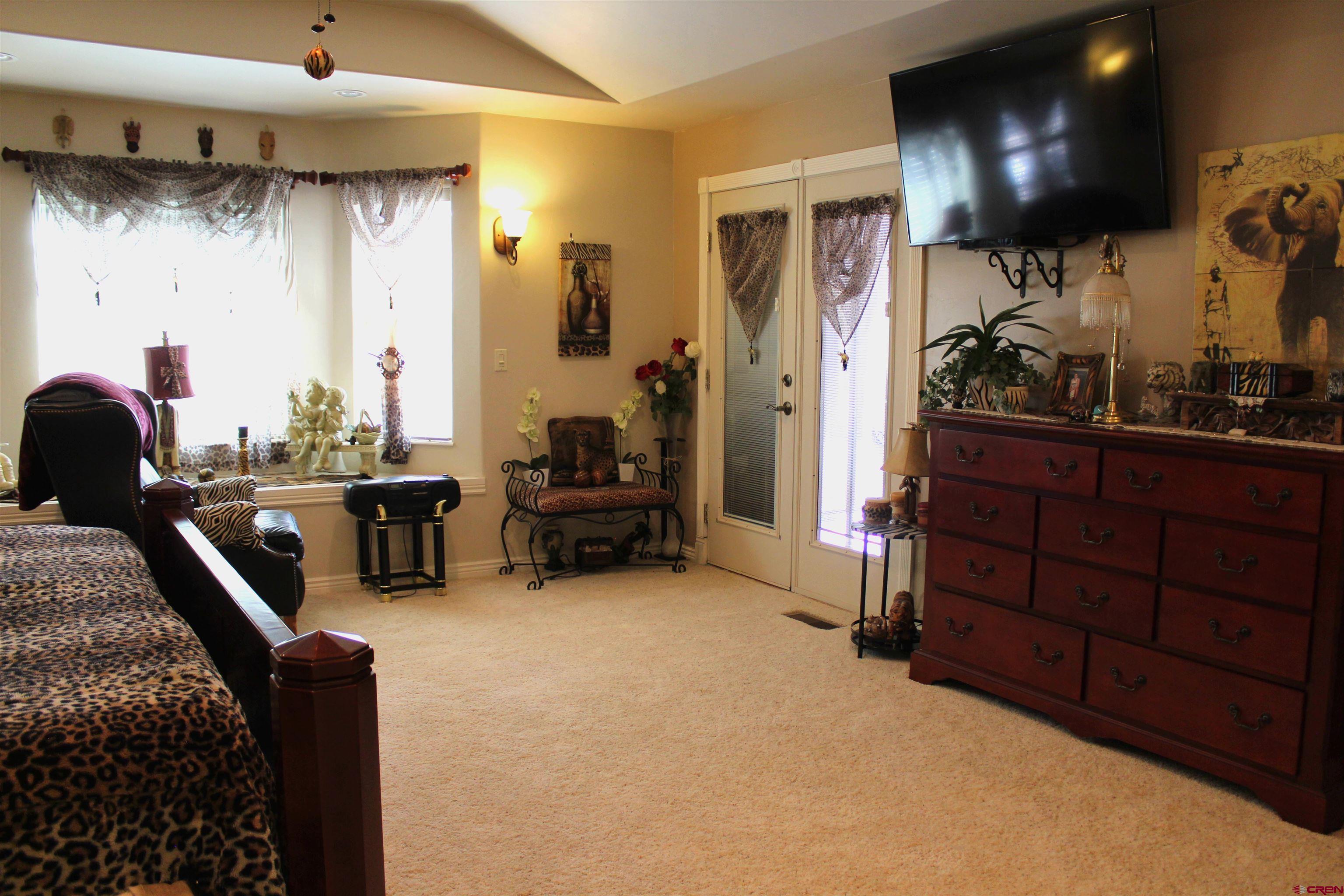 635 Northeast 2nd Street Cedaredge, CO 81413 - Photo 19 of 33 a living room with furniture and a flat screen tv
