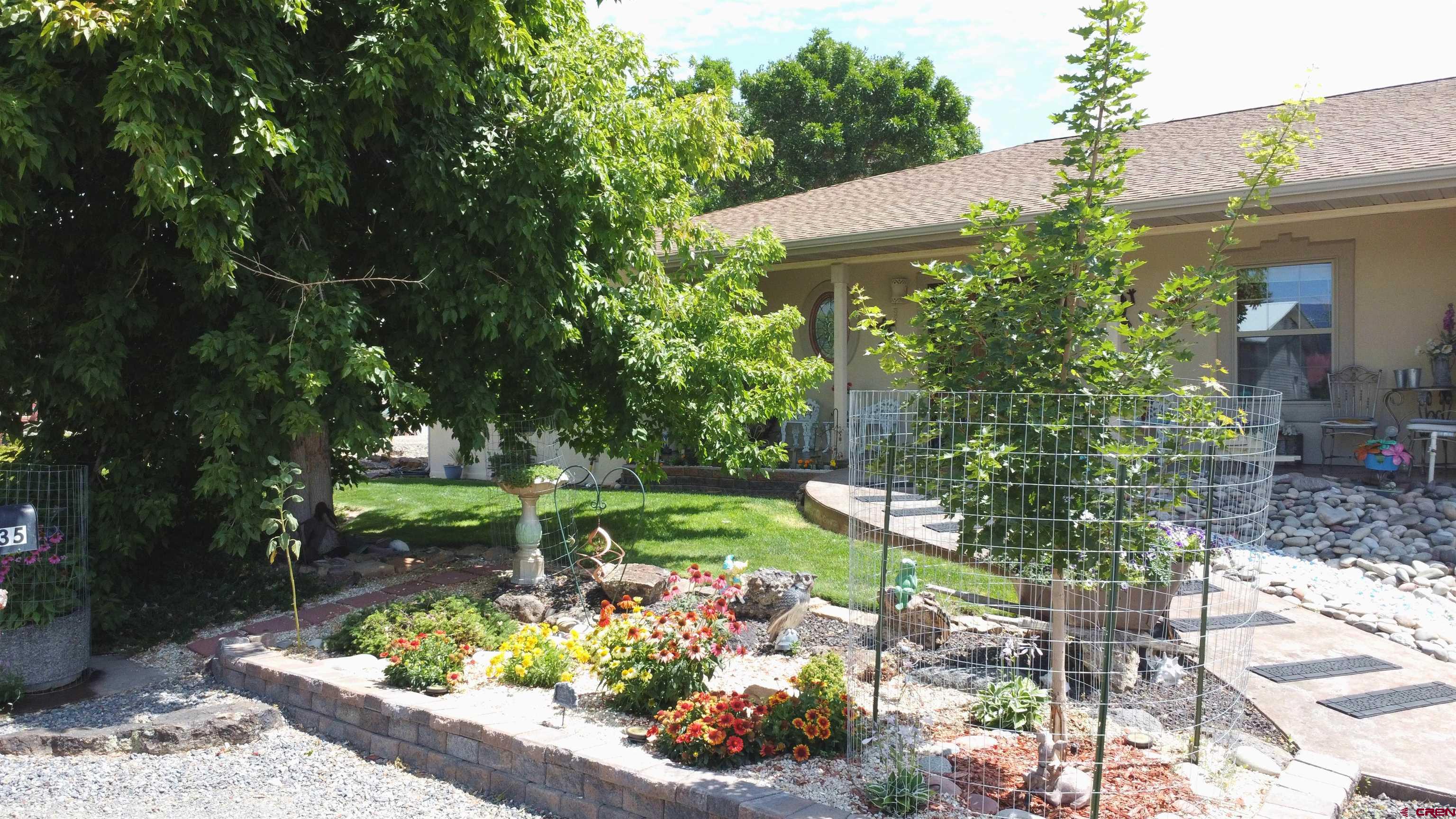 635 Northeast 2nd Street Cedaredge, CO 81413 - Photo 2 of 33 a front view of a house with a yard