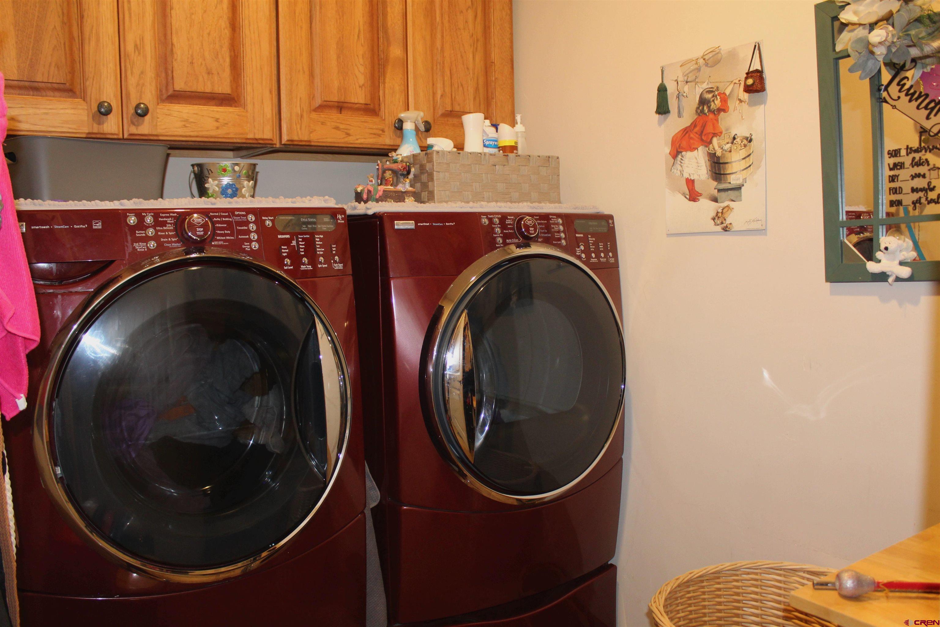 635 Northeast 2nd Street Cedaredge, CO 81413 - Photo 24 of 33 a utility room with dryer and washer
