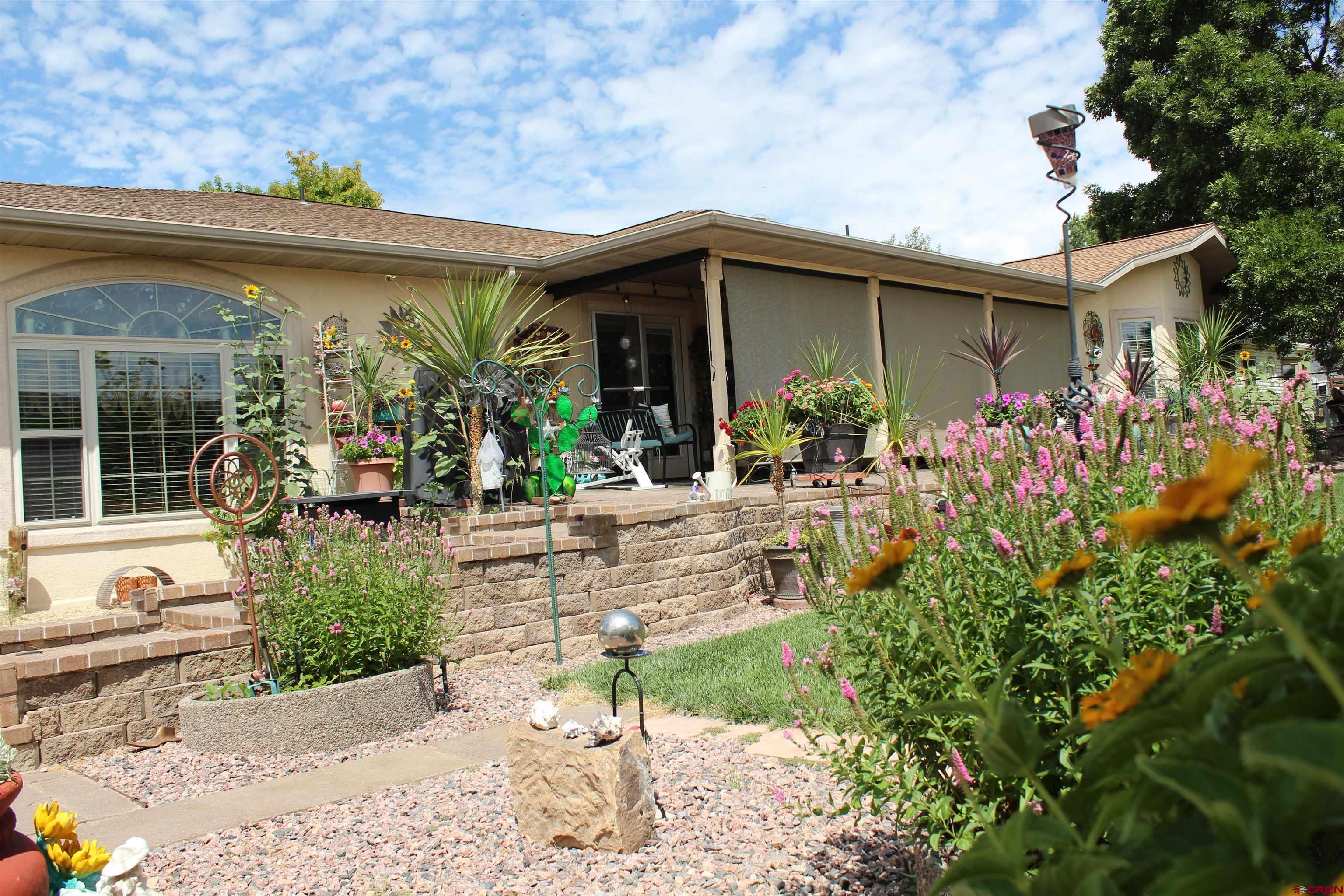 635 Northeast 2nd Street Cedaredge, CO 81413 - Photo 27 of 33 a view of a house with fountain in front of it