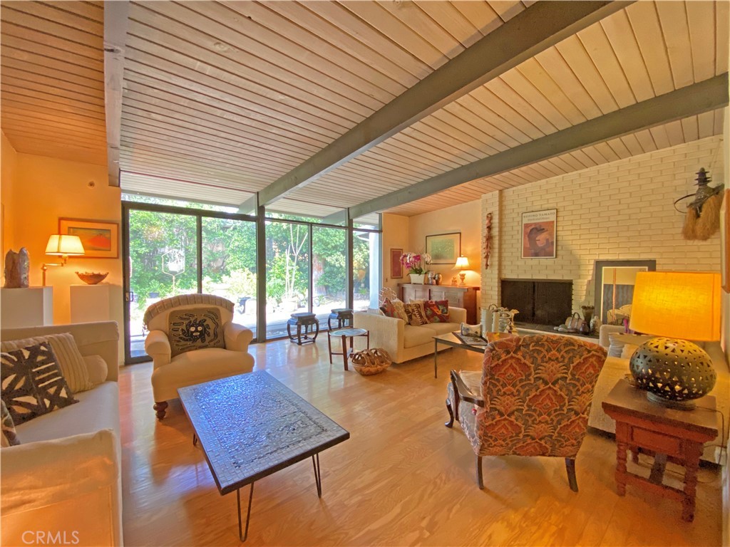 1543 Bates Place Claremont, CA 91711 - Photo 1 of 46 a living room with fireplace furniture and a large window