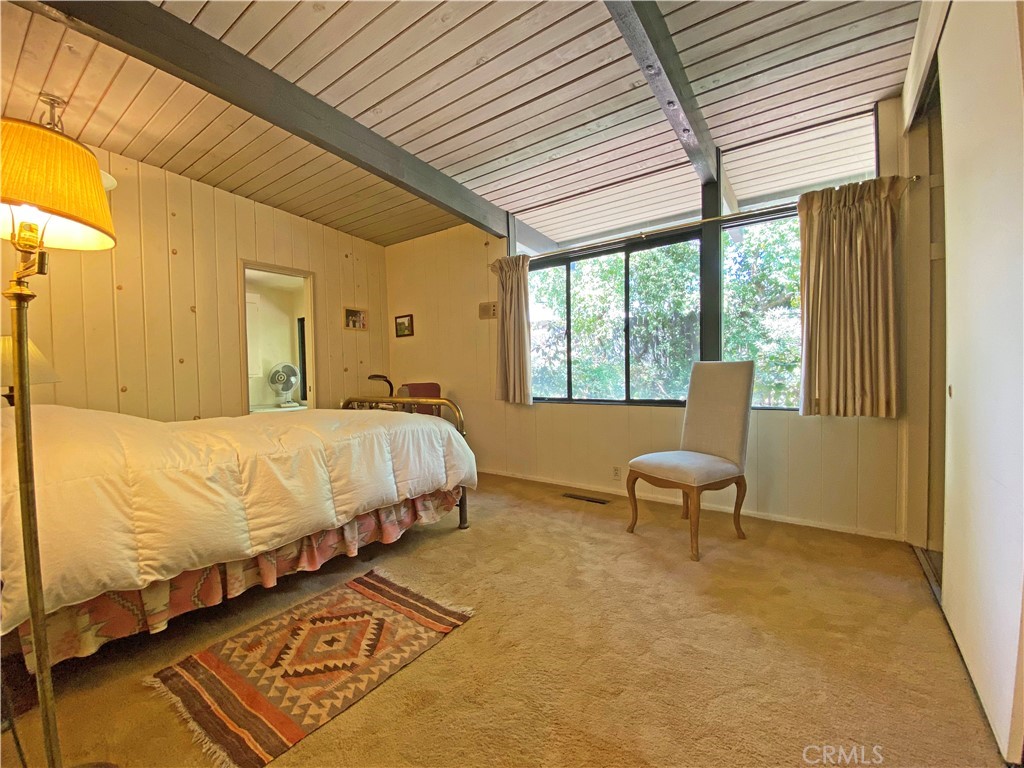 1543 Bates Place Claremont, CA 91711 - Photo 15 of 46 a bedroom with a bed wooden floor and window