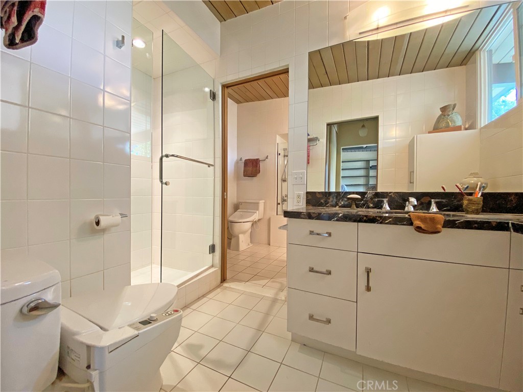 1543 Bates Place Claremont, CA 91711 - Photo 18 of 46 a bathroom with a sink a toilet and shower