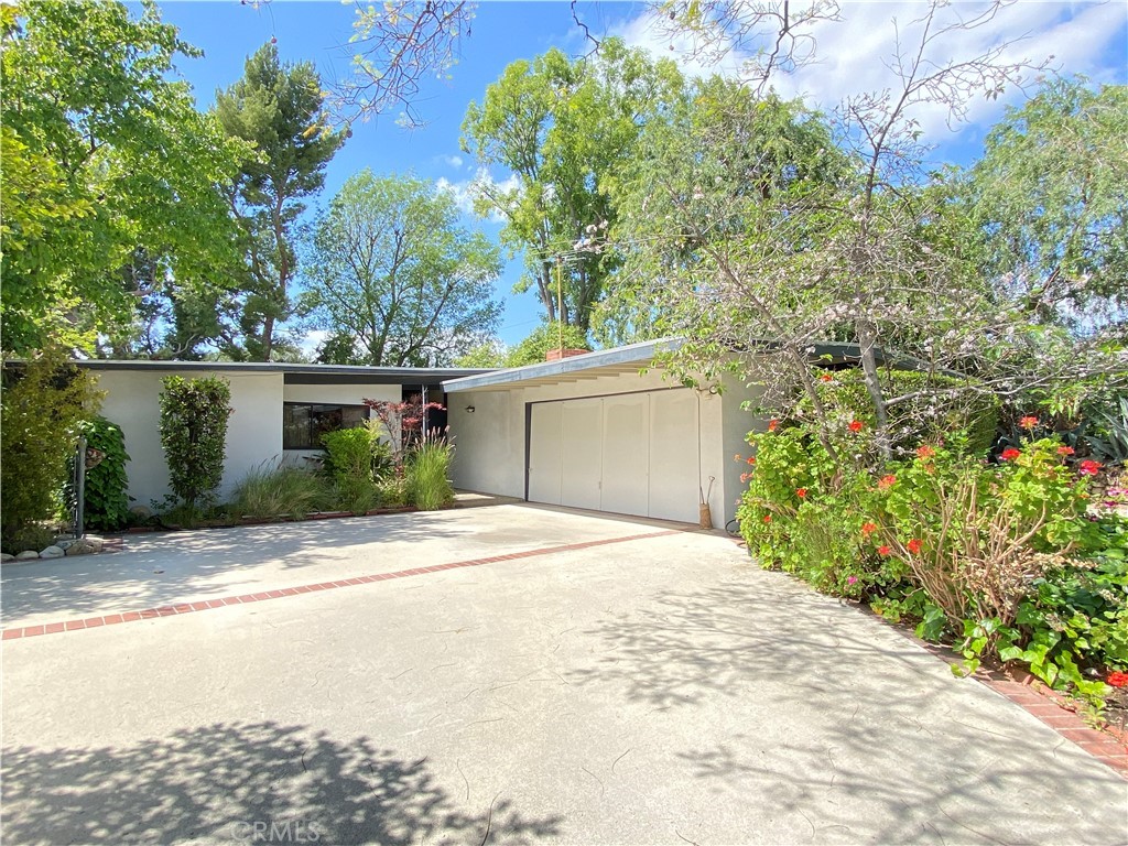 1543 Bates Place Claremont, CA 91711 - Photo 2 of 46 a front view of a house with a yard and trees