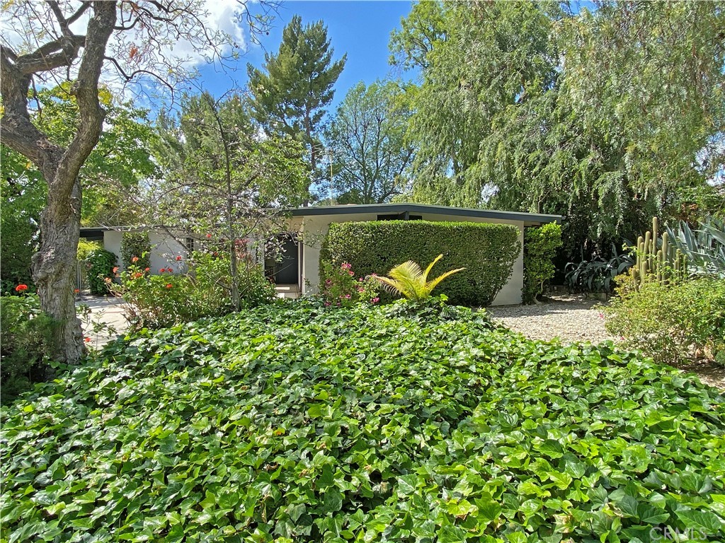 1543 Bates Place Claremont, CA 91711 - Photo 3 of 46 a view of a garden with a bench