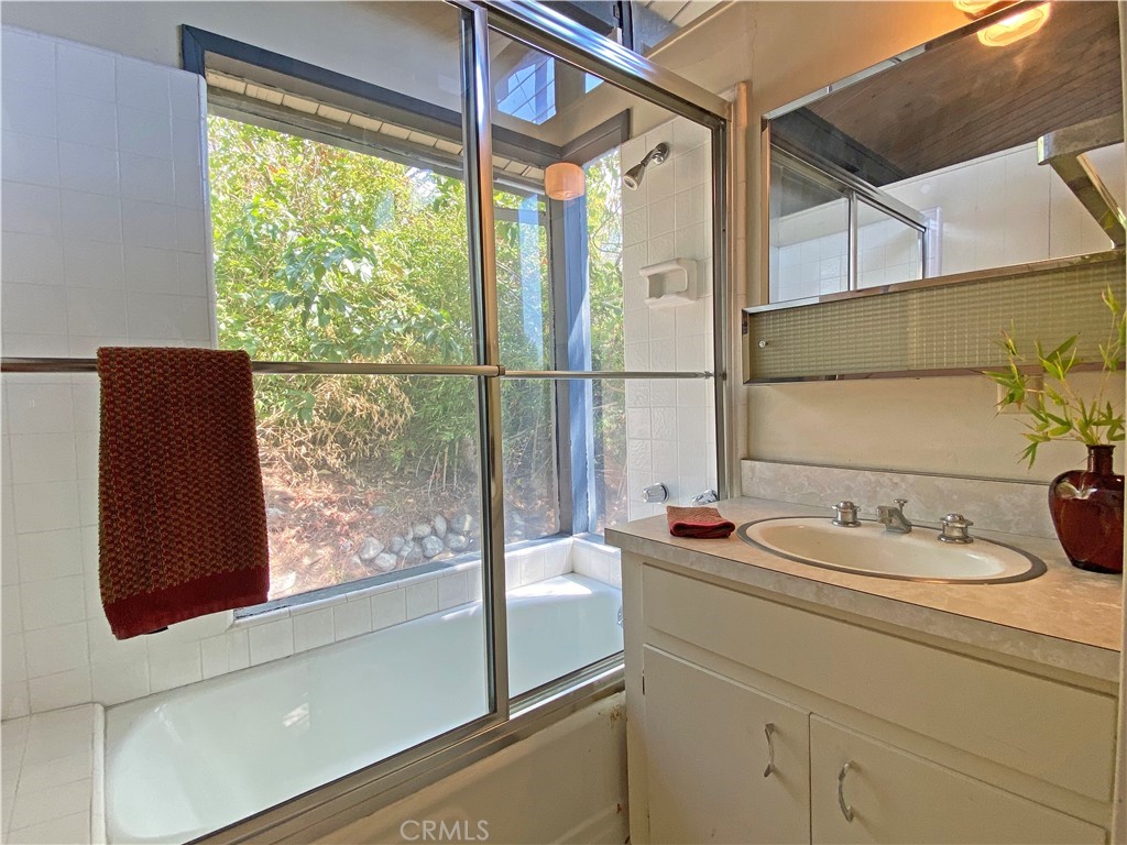 1543 Bates Place Claremont, CA 91711 - Photo 34 of 46 a bathroom with a sink and a window