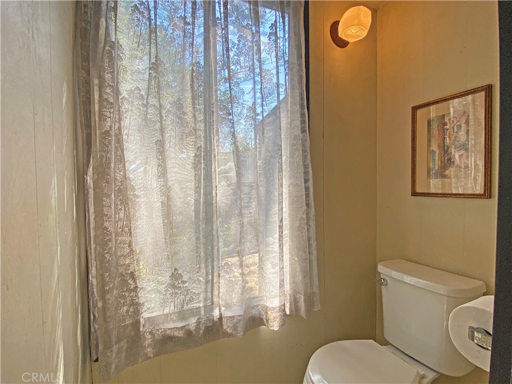 1543 Bates Place Claremont, CA 91711 - Photo 35 of 46 a white toilet sitting next to a shower curtain