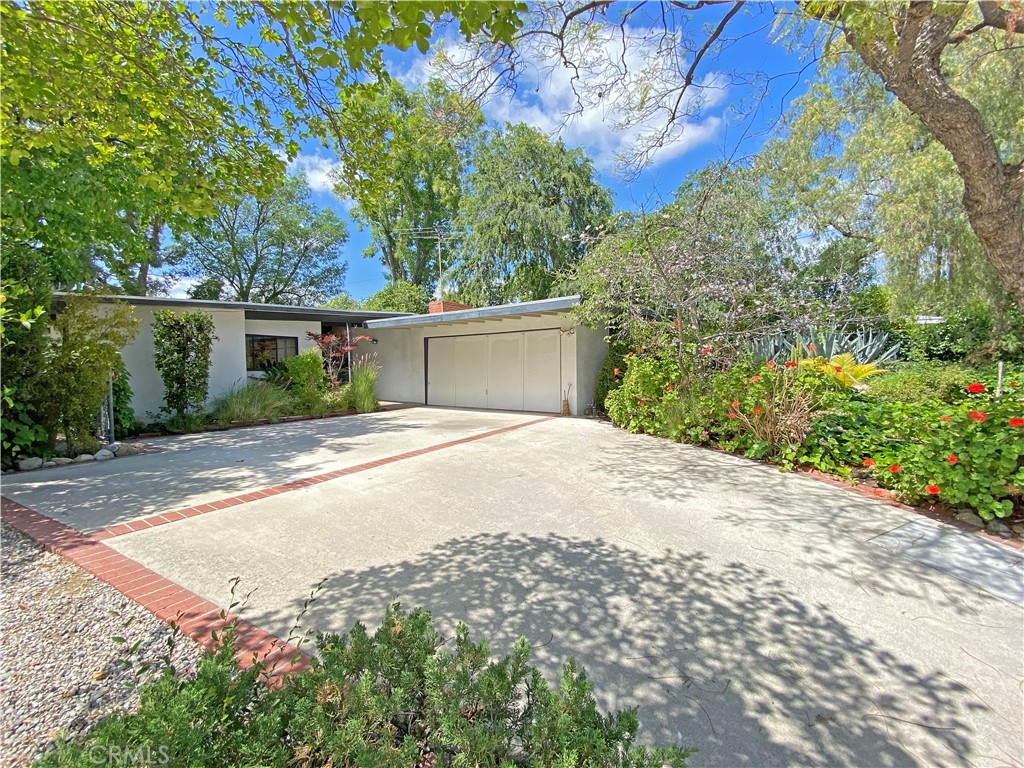 1543 Bates Place Claremont, CA 91711 - Photo 4 of 46 a view of a house with a yard and garage