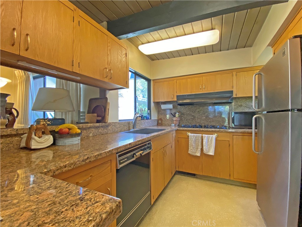 1543 Bates Place Claremont, CA 91711 - Photo 10 of 46 a kitchen with stainless steel appliances granite countertop a sink and a refrigerator