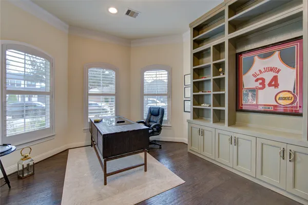 a living room with furniture and windows
