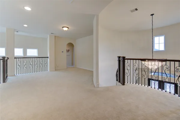 a view of a hallway with a chandelier