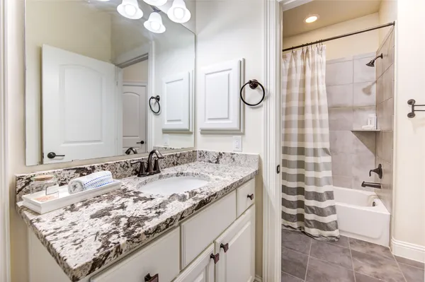 a bathroom with a sink double vanity and a mirror