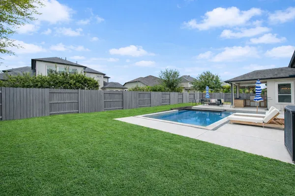 a view of outdoor space yard and swimming pool