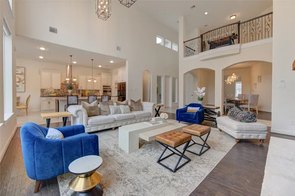a living room with lots of furniture and a rug