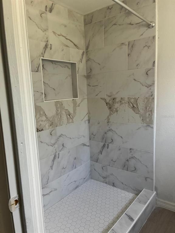 1008 Nebraska Street Leesburg, FL 34748 - Photo 13 of 26 a bathroom with a shower