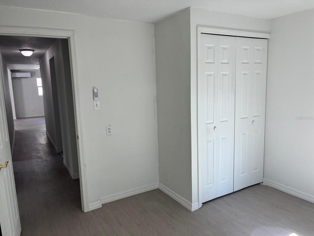 1008 Nebraska Street Leesburg, FL 34748 - Photo 17 of 26 a view of a hallway with wooden floor