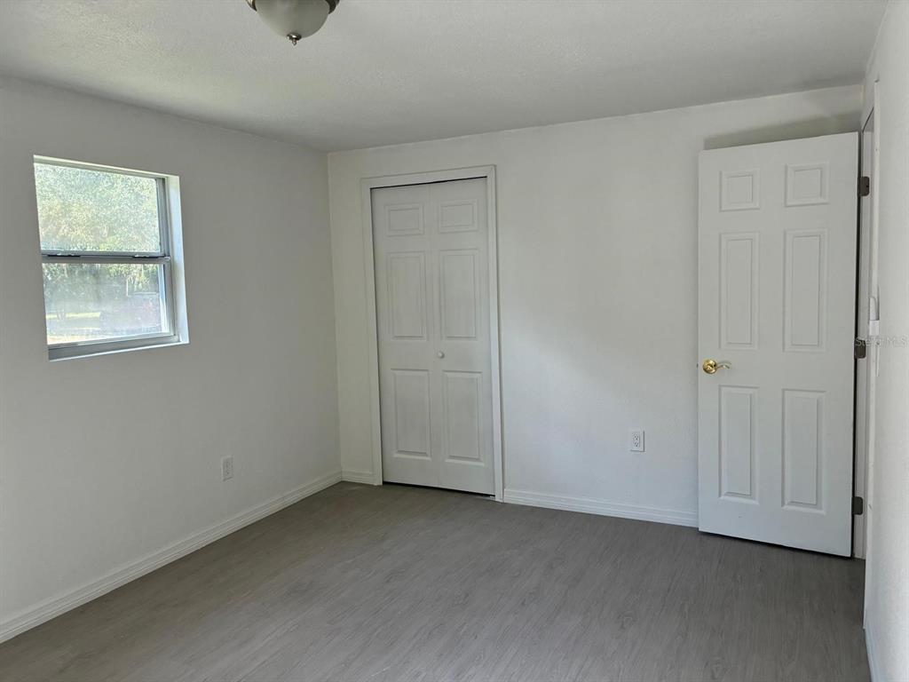 1008 Nebraska Street Leesburg, FL 34748 - Photo 18 of 26 a view of an empty room with a window
