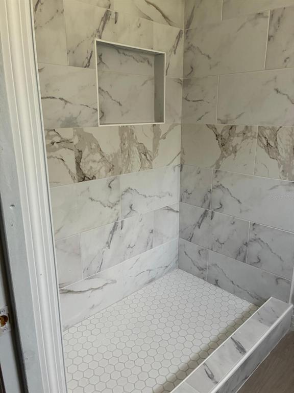 1008 Nebraska Street Leesburg, FL 34748 - Photo 23 of 26 a bathroom with a bathtub