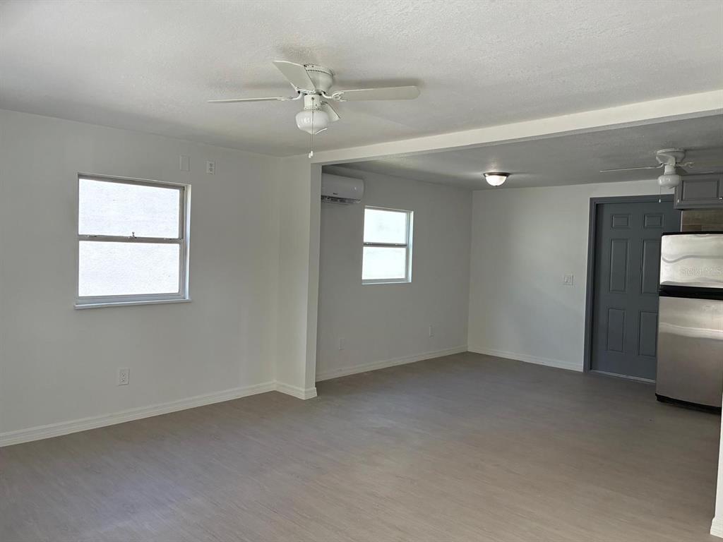 1008 Nebraska Street Leesburg, FL 34748 - Photo 3 of 26 an empty room with windows