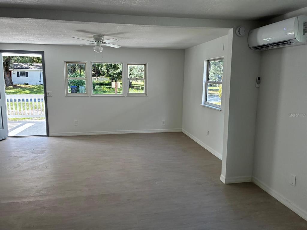 1008 Nebraska Street Leesburg, FL 34748 - Photo 7 of 26 an empty room with windows