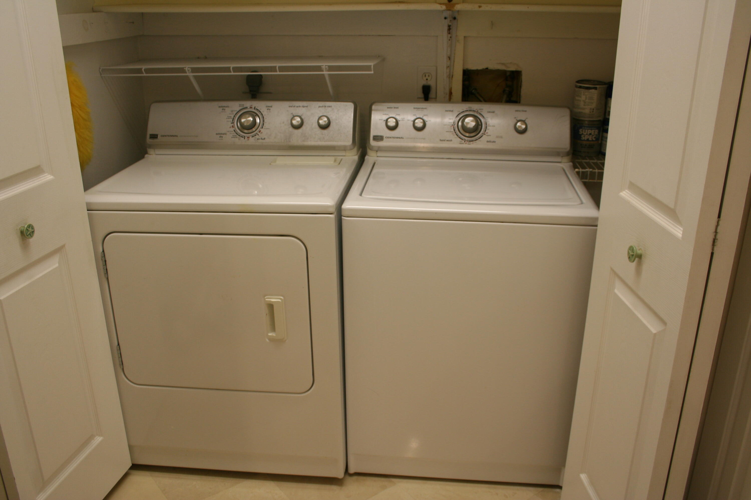 104500 Overseas Highway, Unit A302 Key Largo, FL 33037 - Photo 22 of 35 a utility room with dryer and washer