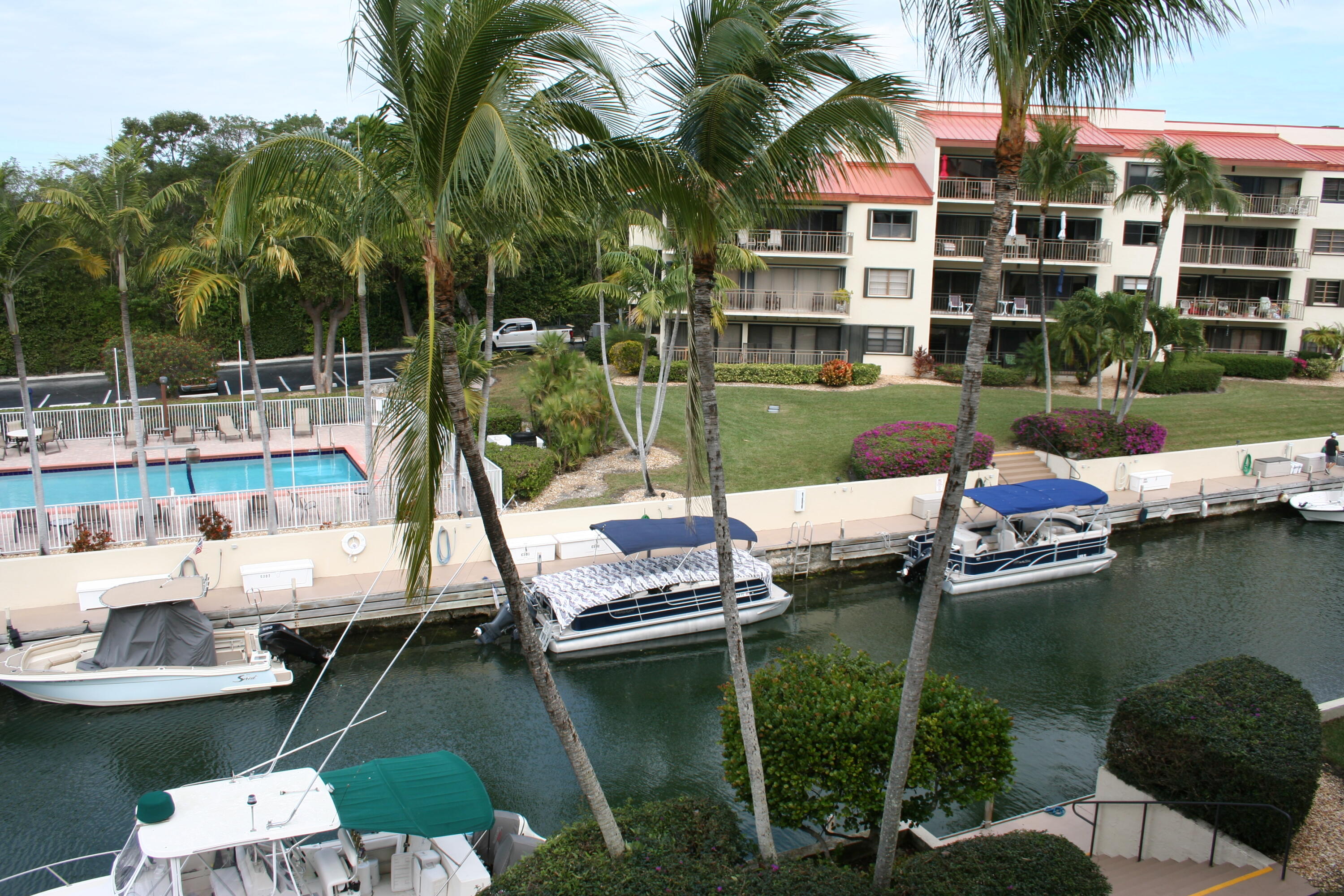 104500 Overseas Highway, Unit A302 Key Largo, FL 33037 - Photo 26 of 35 a view of a lake with a house