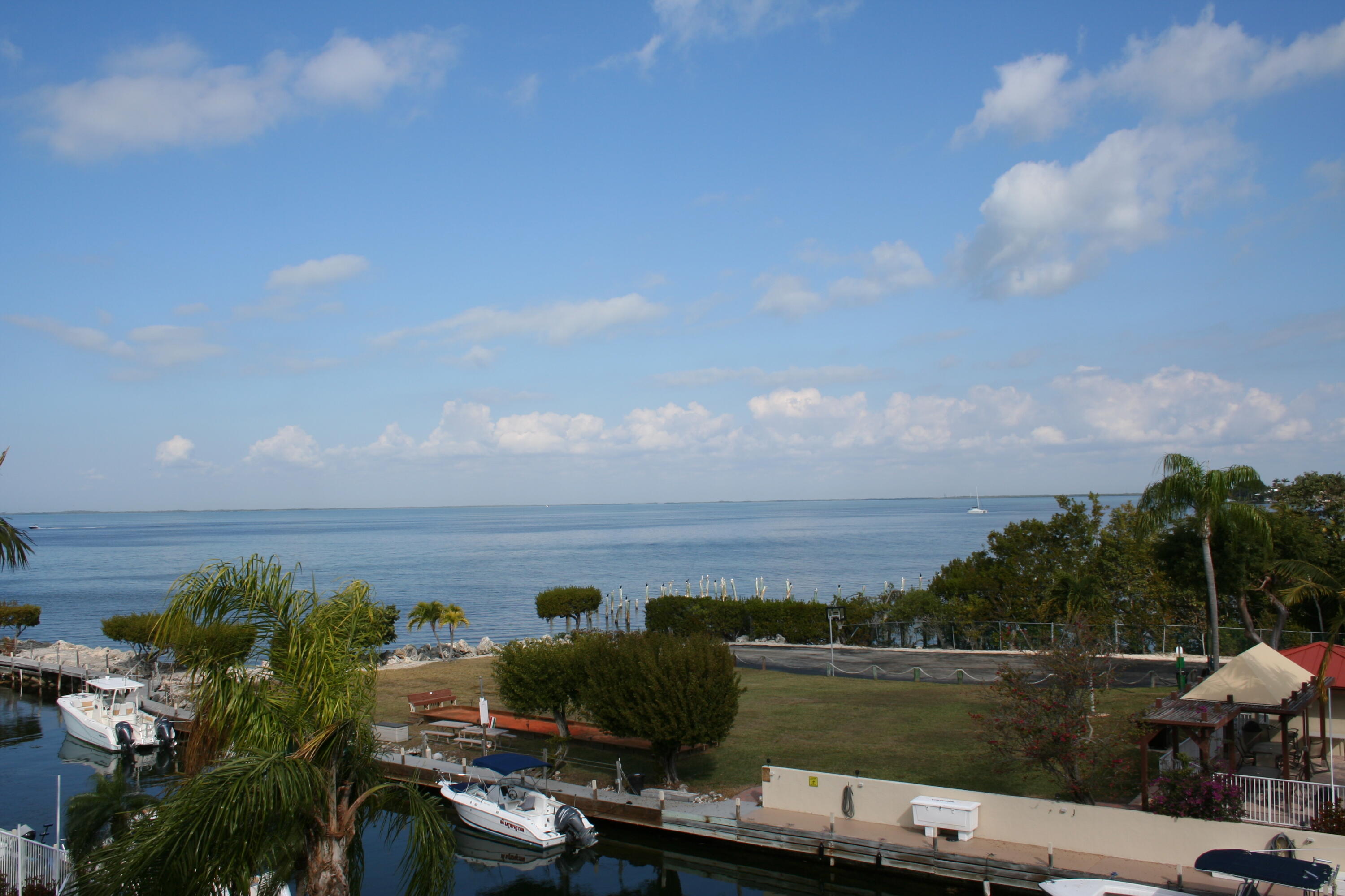 104500 Overseas Highway, Unit A302 Key Largo, FL 33037 - Photo 30 of 35 a view of a lake with houses