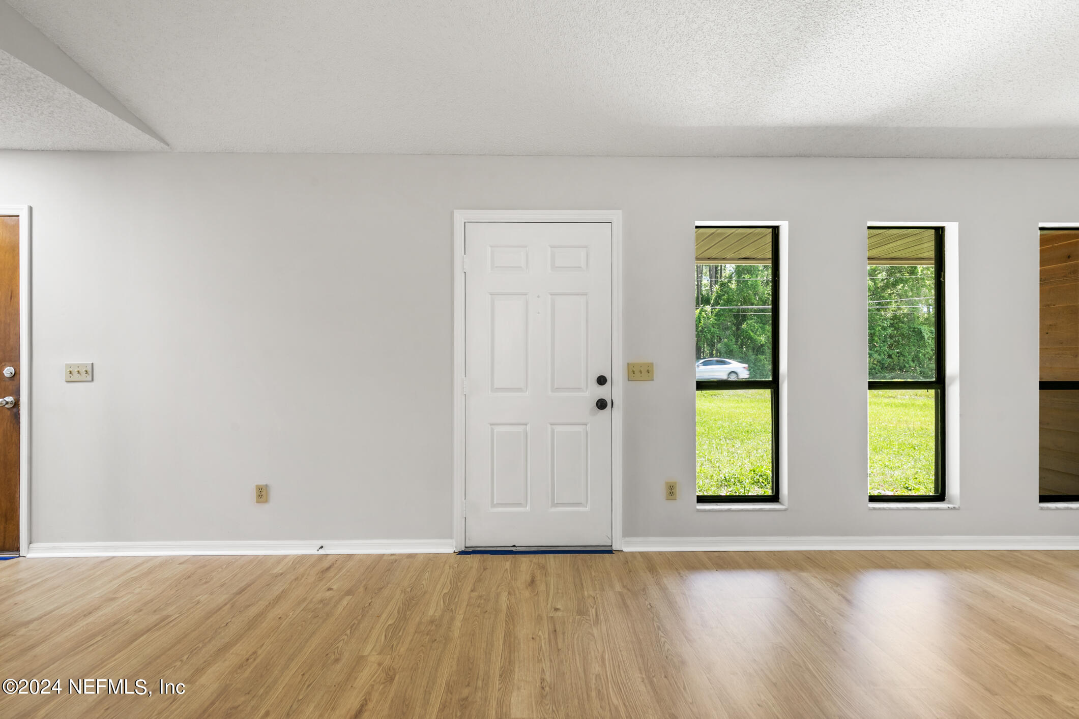5165 Datil Pepper Road St. Augustine, FL 32086 - Photo 12 of 54 a view of an empty room with window and wooden floor