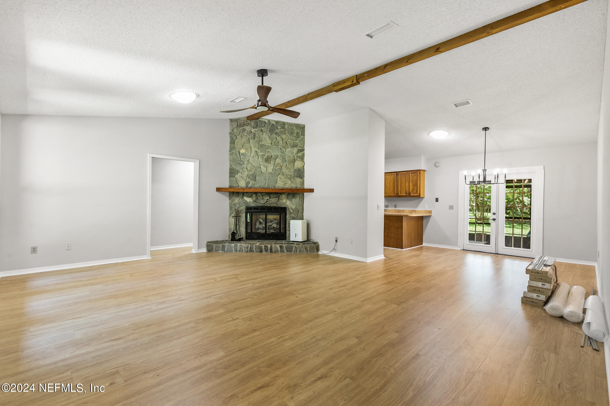 5165 Datil Pepper Road St. Augustine, FL 32086 - Photo 13 of 54 a view of empty room with wooden floor and fireplace
