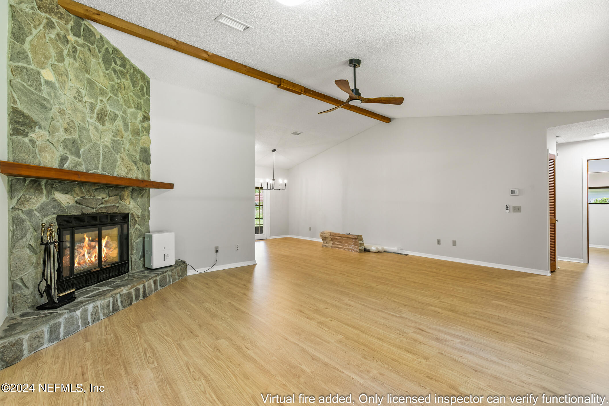 5165 Datil Pepper Road St. Augustine, FL 32086 - Photo 15 of 54 a view of empty room with wooden floor and fireplace