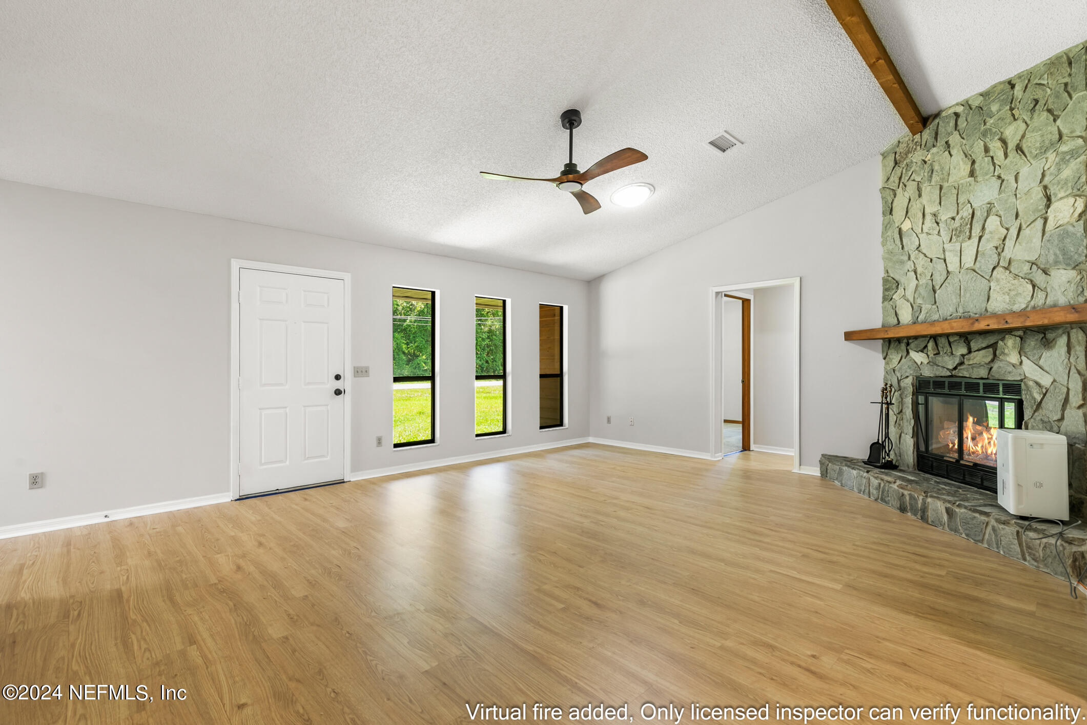 5165 Datil Pepper Road St. Augustine, FL 32086 - Photo 18 of 54 a view of an empty room with a window and wooden floor