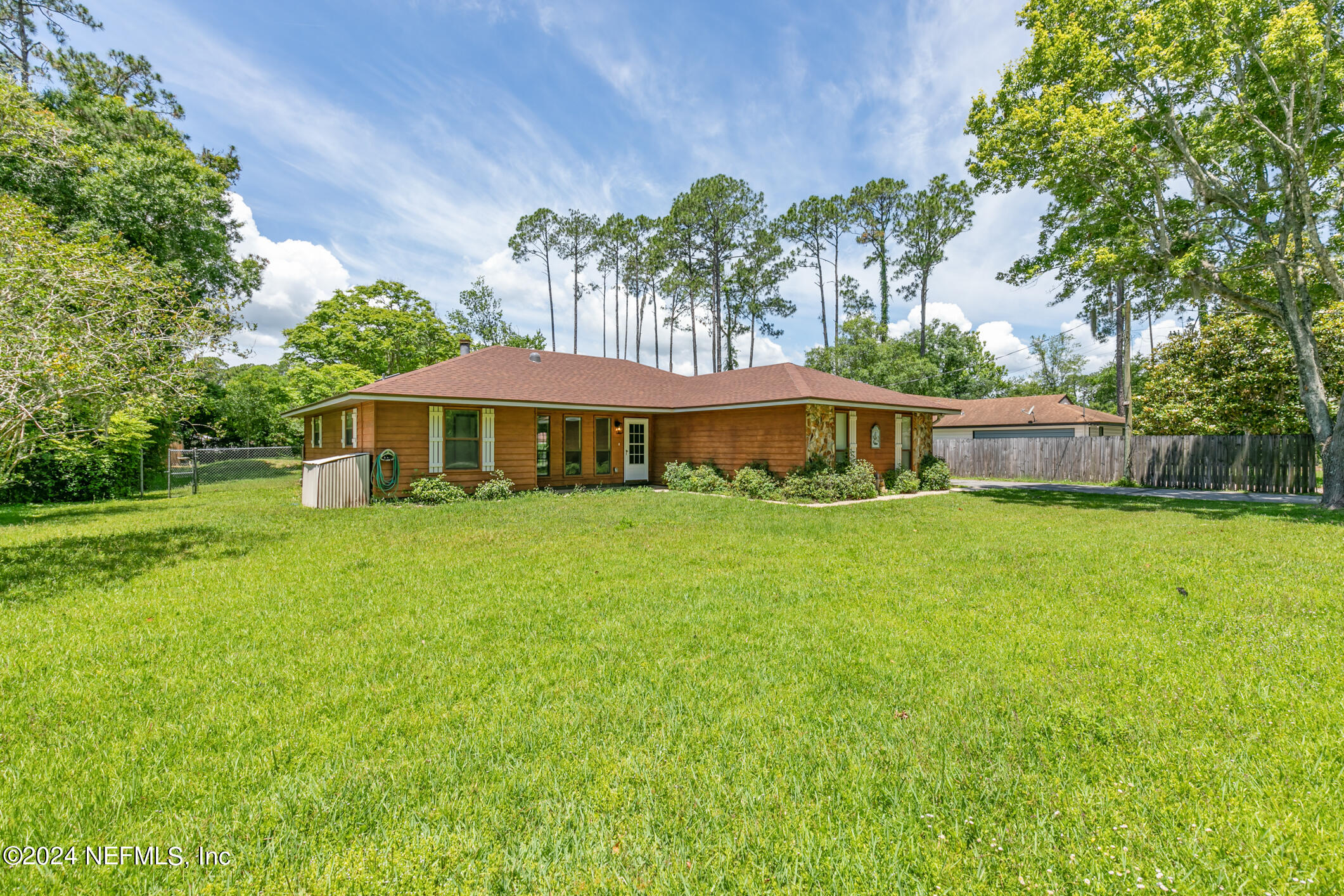 5165 Datil Pepper Road St. Augustine, FL 32086 - Photo 2 of 54 a front view of a house with a yard