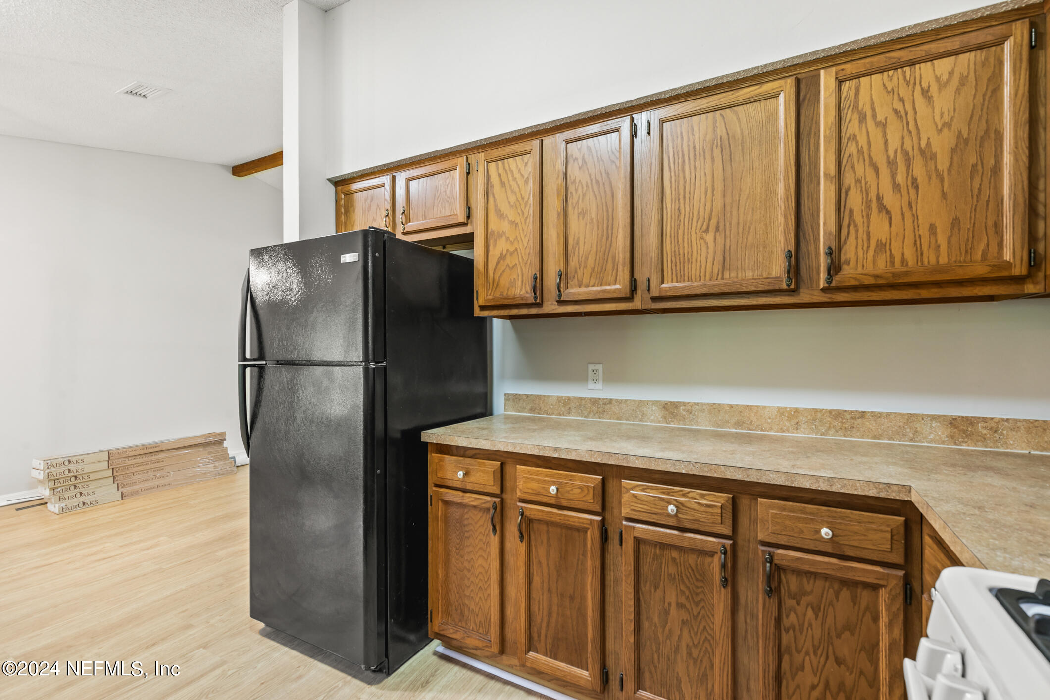 5165 Datil Pepper Road St. Augustine, FL 32086 - Photo 25 of 54 a kitchen with stainless steel appliances granite countertop a refrigerator and cabinets