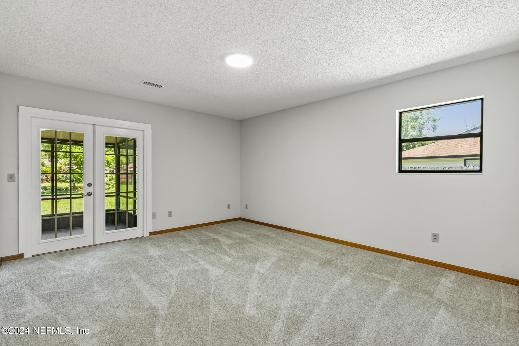 5165 Datil Pepper Road St. Augustine, FL 32086 - Photo 27 of 54 a view of an empty room with a window