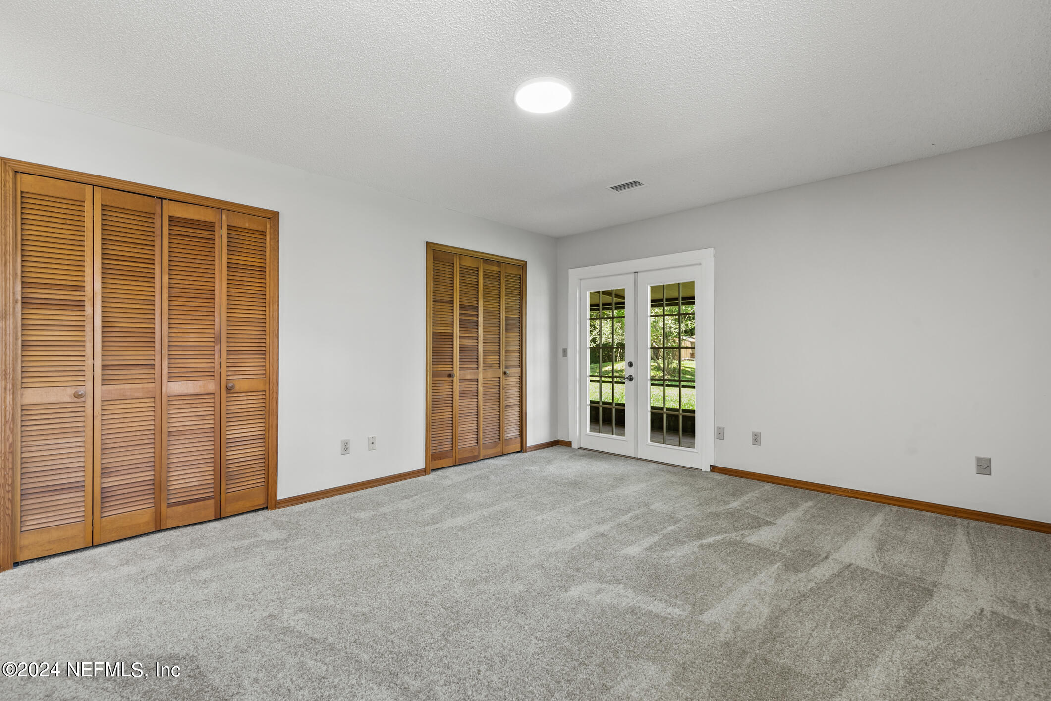 5165 Datil Pepper Road St. Augustine, FL 32086 - Photo 28 of 54 an empty room with windows