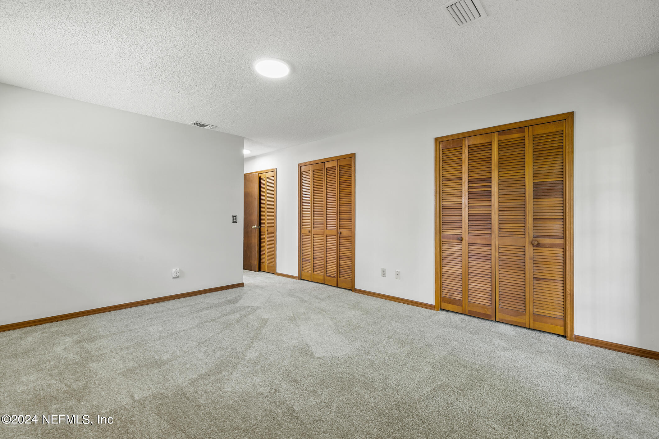 5165 Datil Pepper Road St. Augustine, FL 32086 - Photo 29 of 54 an empty room with windows