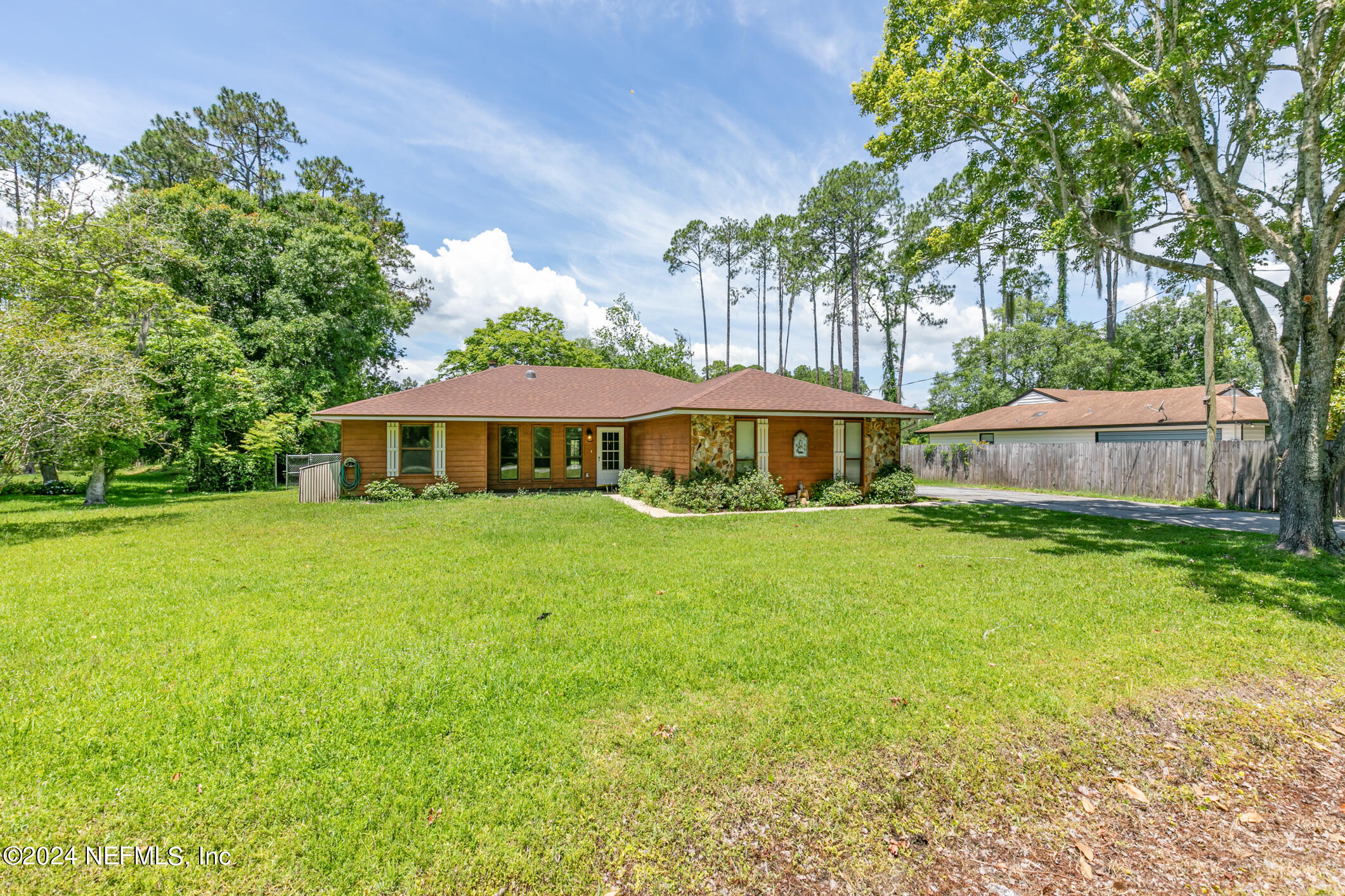 5165 Datil Pepper Road St. Augustine, FL 32086 - Photo 3 of 54 a front view of a house with yard and green space