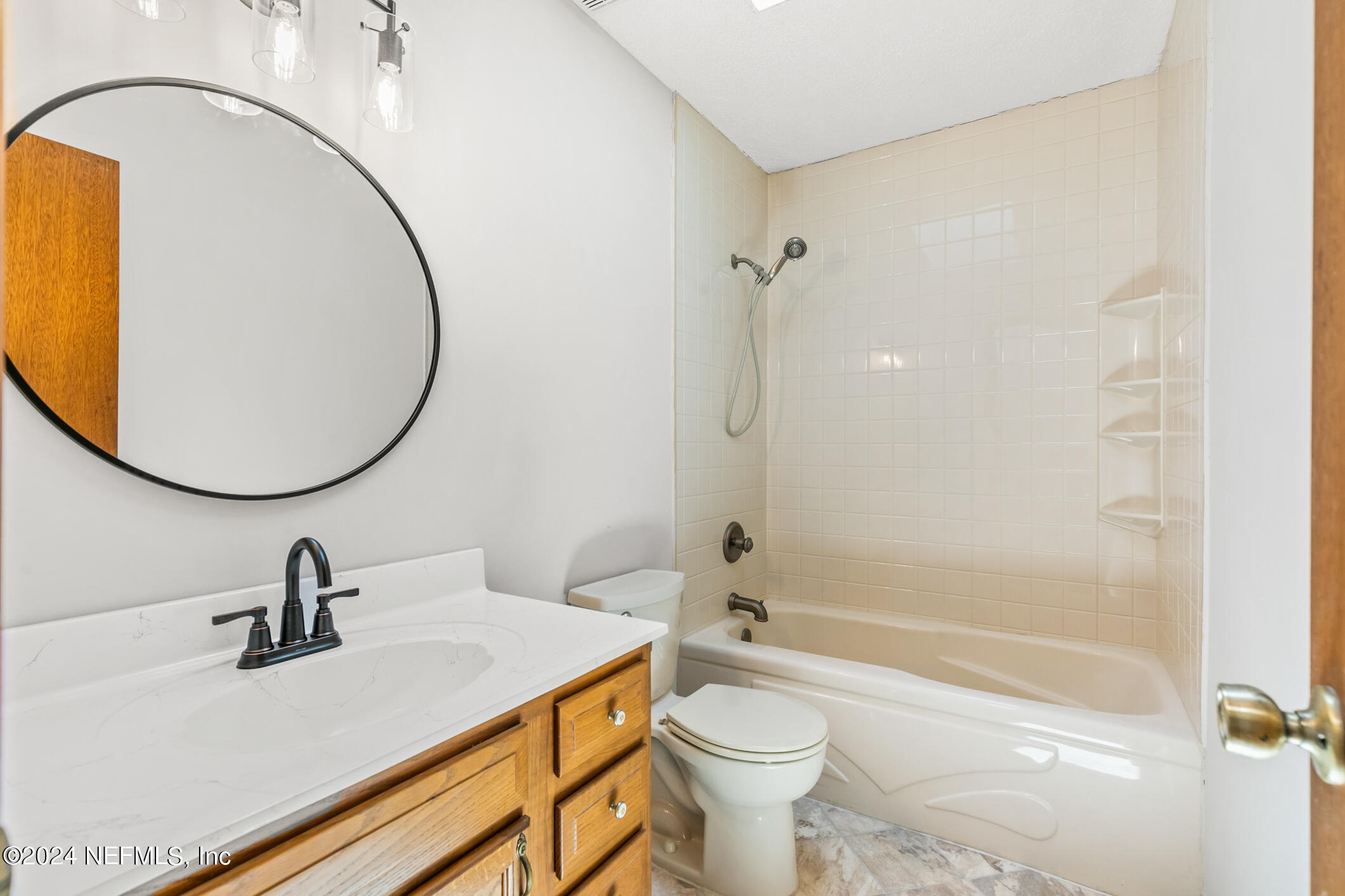 5165 Datil Pepper Road St. Augustine, FL 32086 - Photo 37 of 54 a bathroom with a sink a toilet and a mirror