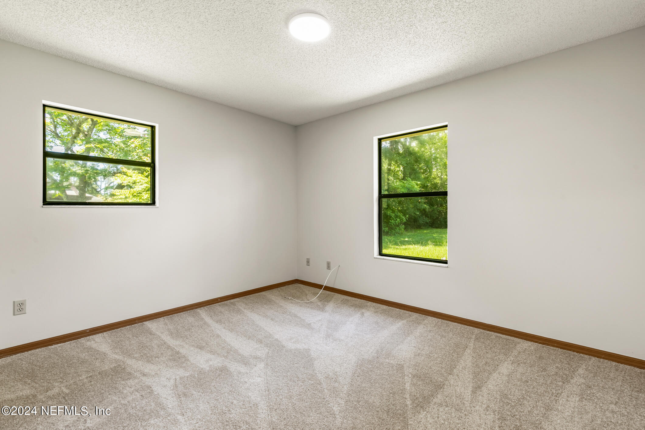 5165 Datil Pepper Road St. Augustine, FL 32086 - Photo 38 of 54 a view of an empty room with a window