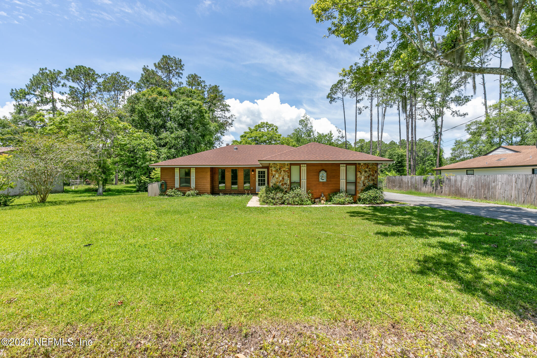 5165 Datil Pepper Road St. Augustine, FL 32086 - Photo 4 of 54 a front view of a house with a garden