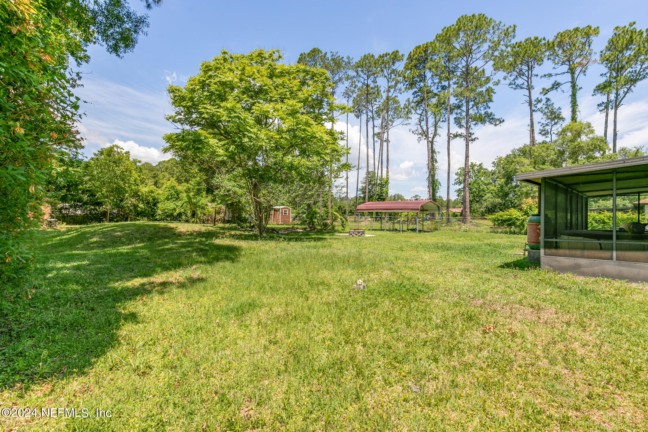 5165 Datil Pepper Road St. Augustine, FL 32086 - Photo 46 of 54 a garden with trees in front of it