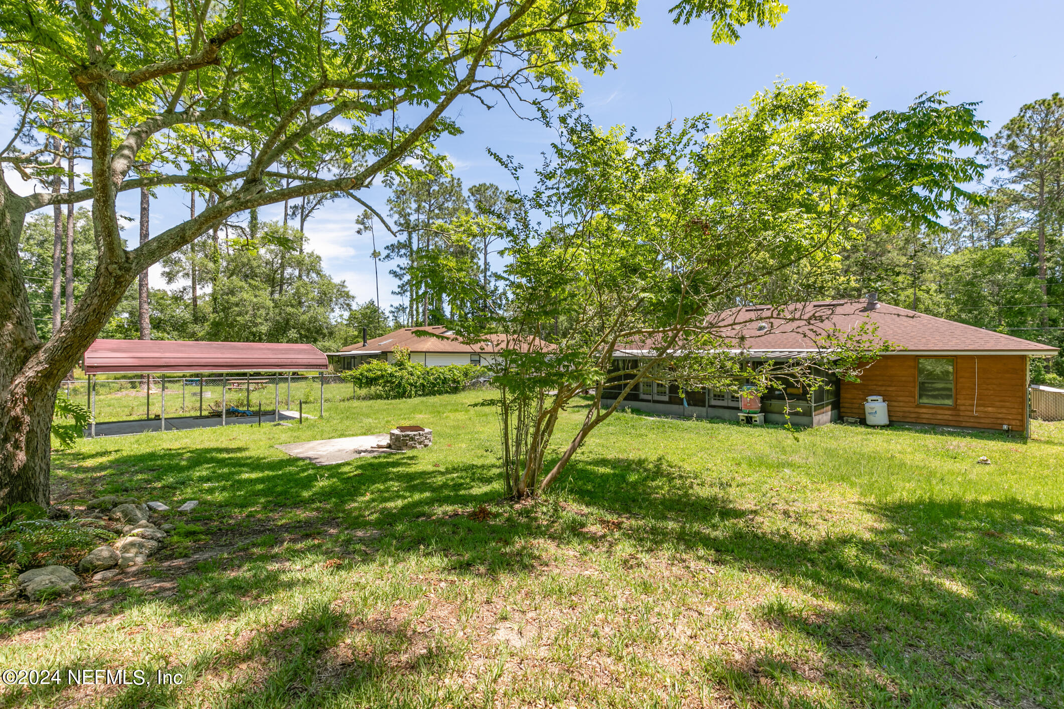 5165 Datil Pepper Road St. Augustine, FL 32086 - Photo 48 of 54 a view of a house with a yard