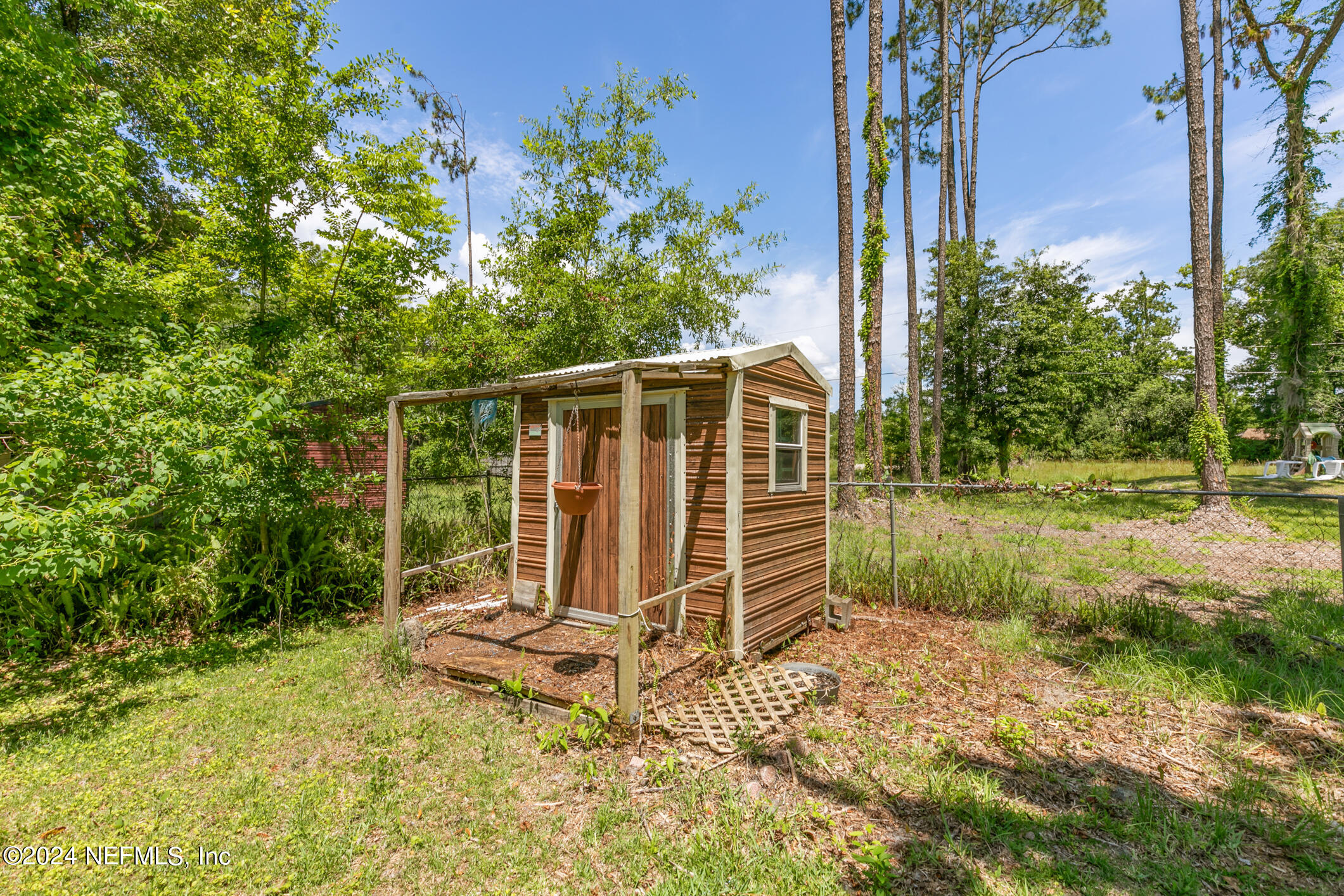 5165 Datil Pepper Road St. Augustine, FL 32086 - Photo 49 of 54 a view of a small house with yard and sitting area