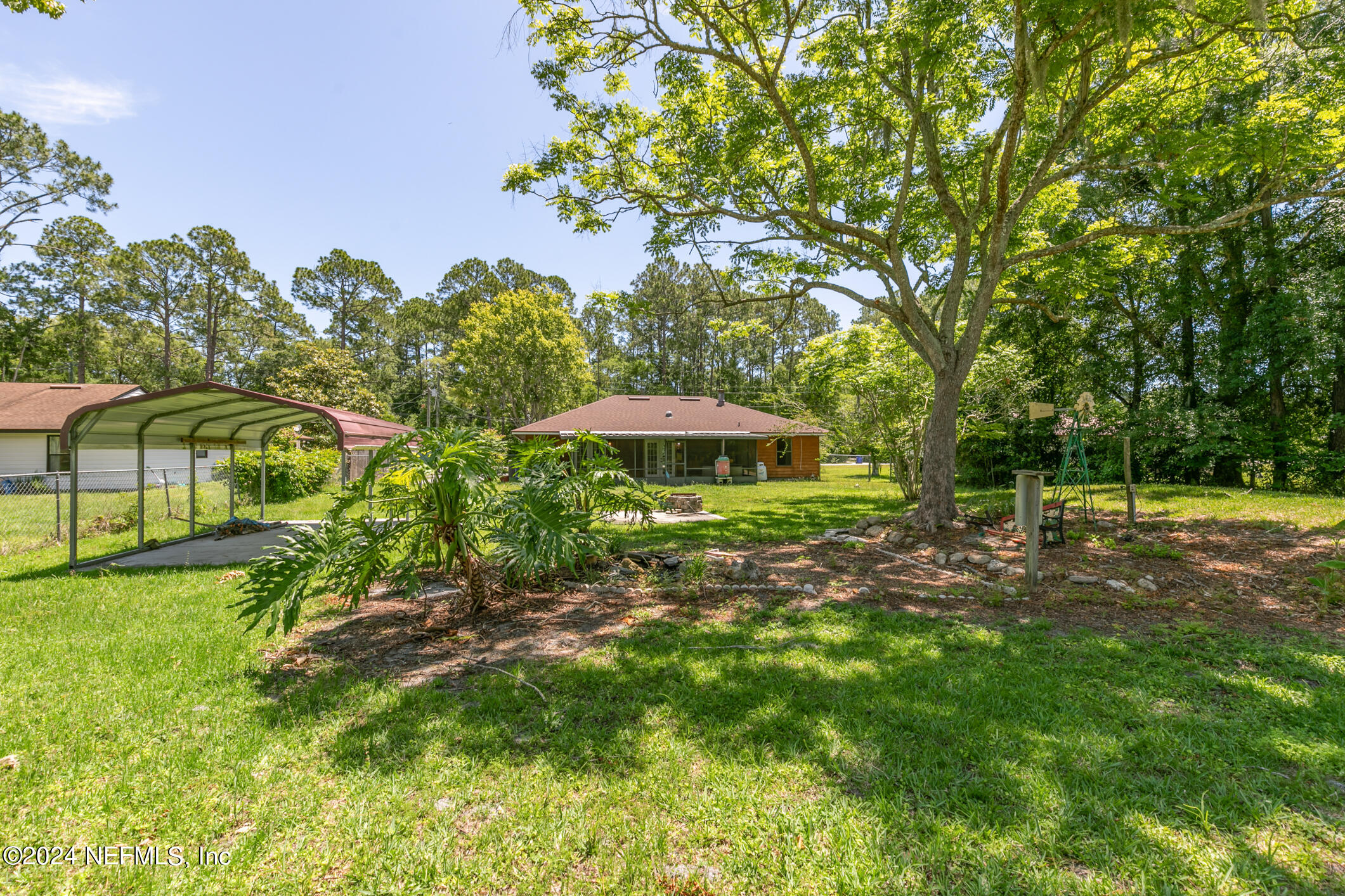 5165 Datil Pepper Road St. Augustine, FL 32086 - Photo 50 of 54 a view of a garden with a tree