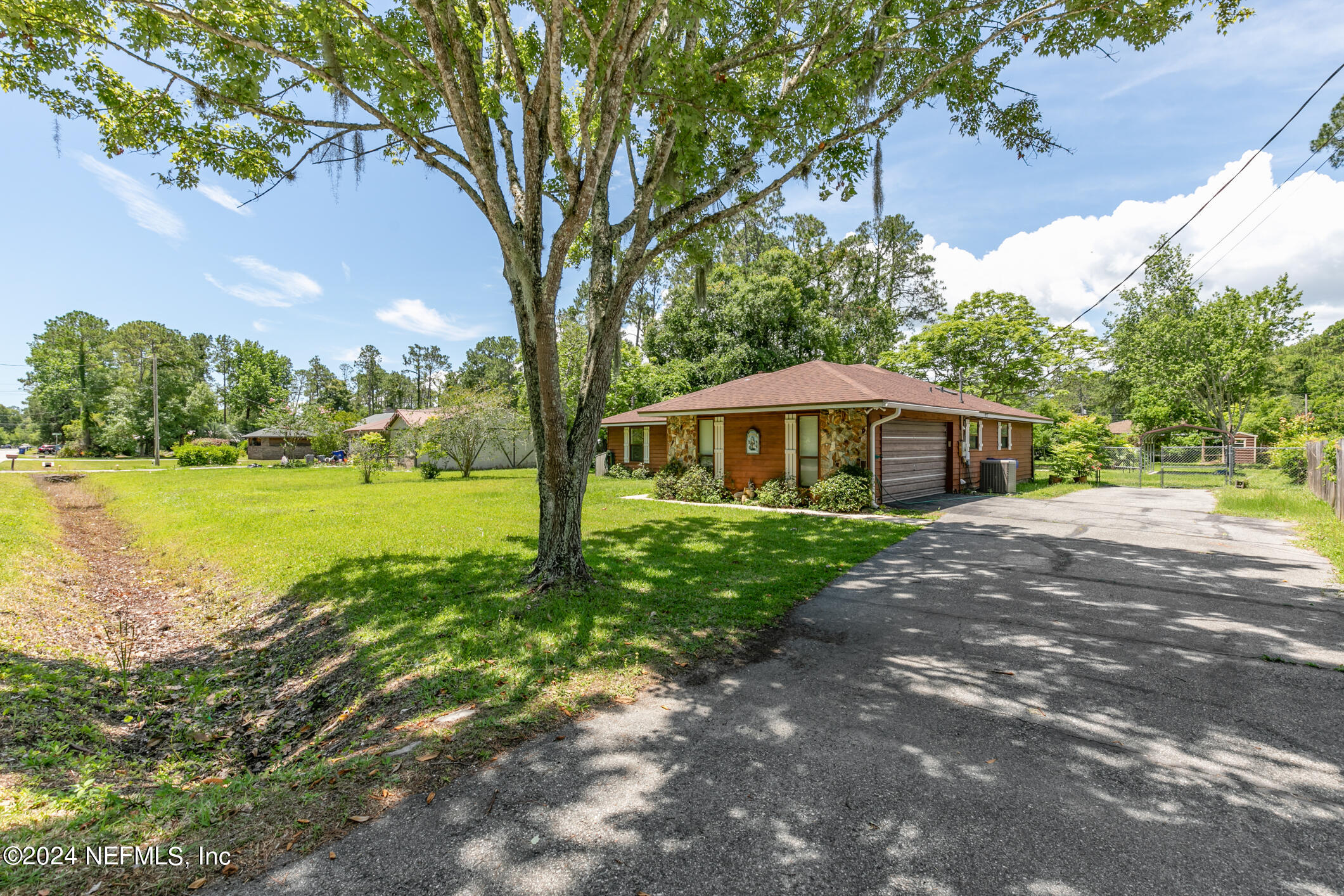 5165 Datil Pepper Road St. Augustine, FL 32086 - Photo 5 of 54 a front view of a house with garden
